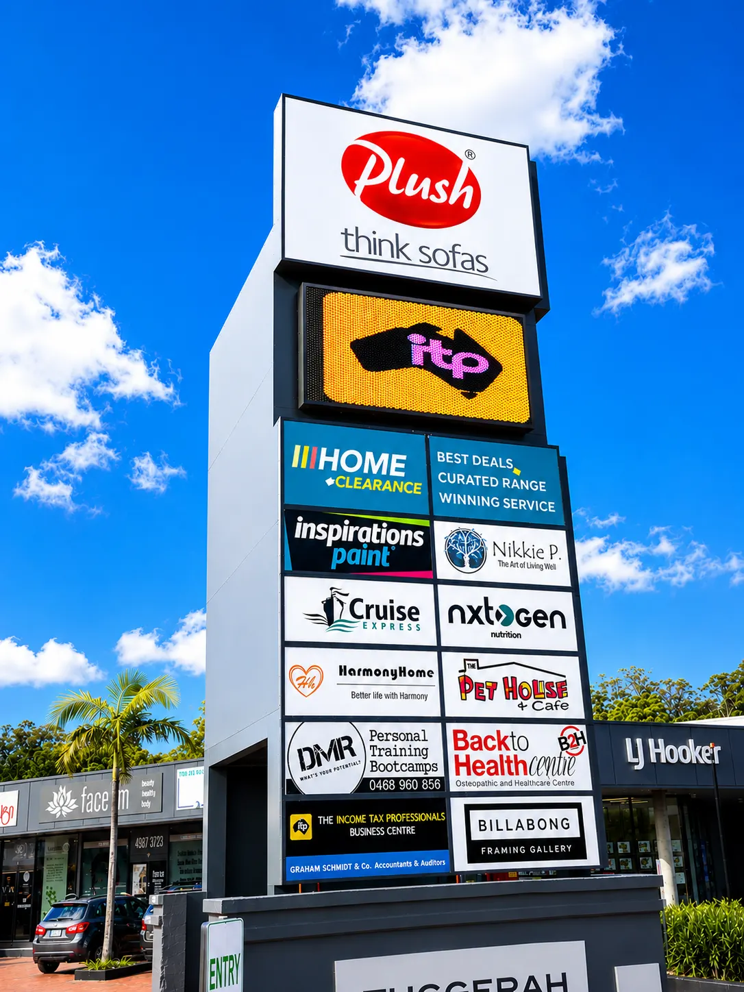 LED pylon sign integrated into a multi-tenant retail and commercial sign in Erina, NSW.
